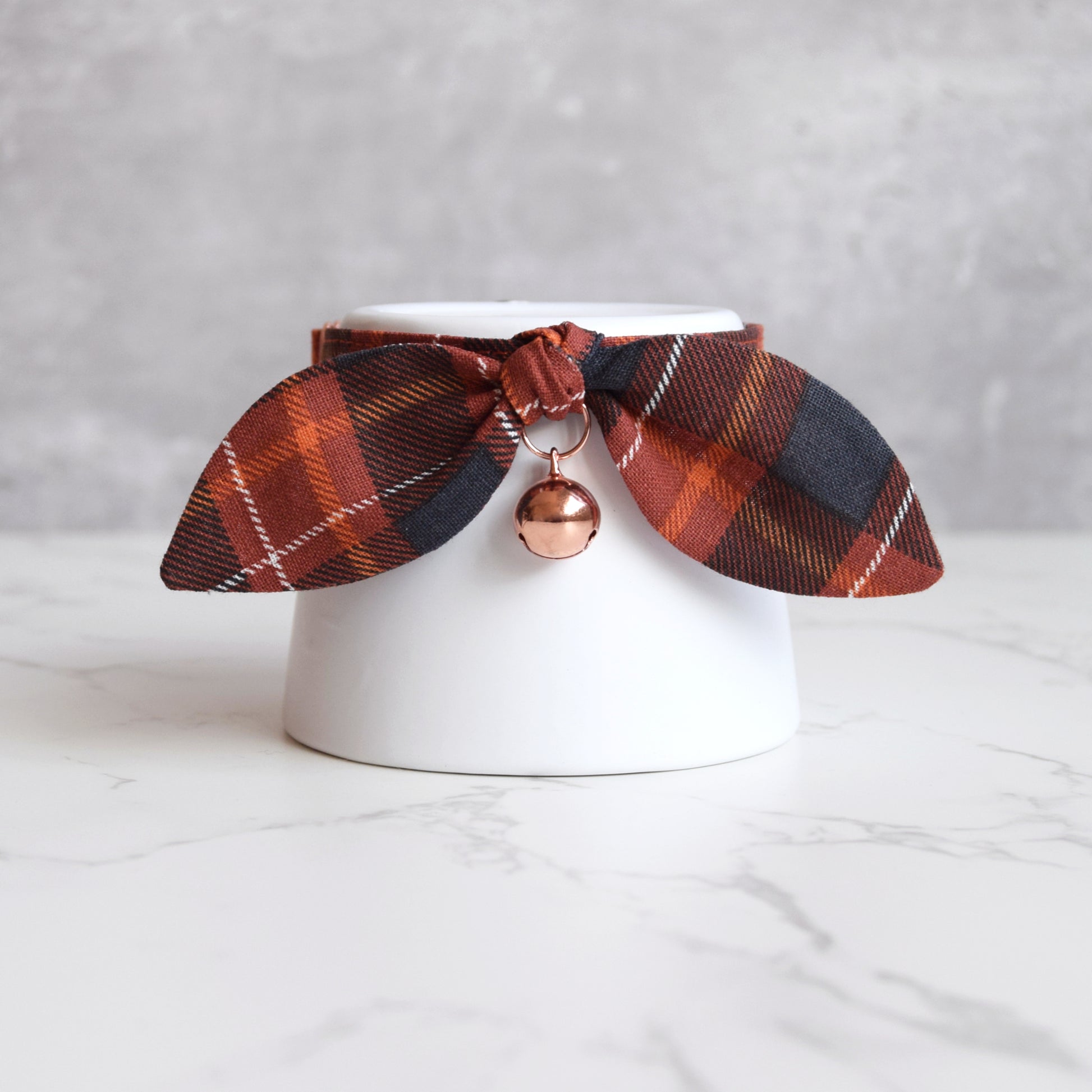 burnt orange plaid cat collar with bow and rose gold bell